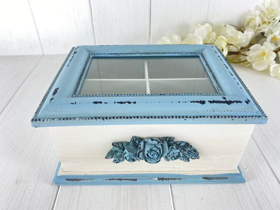 Vintage tea box made of light blue wood with glass lid