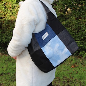 May include: A rustic wooden sign with the text "Welcome to our home" in white lettering. The sign features a distressed finish and a simple, inviting design, perfect for front door decor.