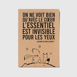 Card with French quote "One sees clearly only with the heart. What is essential is invisible to the eyes" - Antoine de Saint-Exupéry
