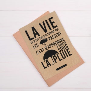 Carte avec citation française "La vie ce n'est pas d'attendre que les orages passent, c'est d'apprendre à danser sous la pluie" image 2