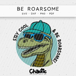 May include: A cartoon illustration of a green dinosaur wearing a teal cap and blue sunglasses. The text "BE ROARSOME" is at the top, with "SVG - DXF - PNG - PDF" below it. The phrase "STAY COOL & BE ROARSOME!" surrounds the dinosaur.