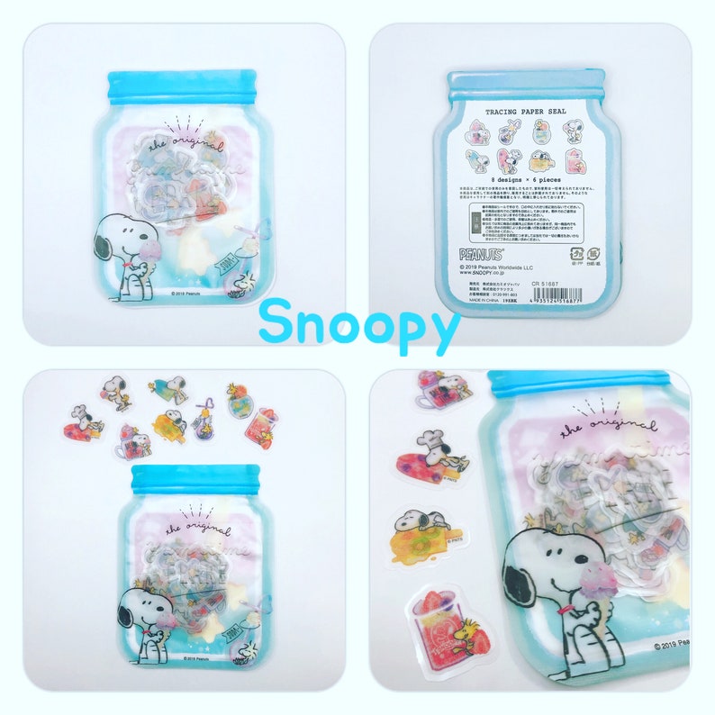 May include: A set of tracing paper stickers featuring the Peanuts characters, including Snoopy, Woodstock, and Charlie Brown. The stickers are packaged in a clear plastic jar with a blue lid. The jar has the text "the original" printed on it. The stickers are perfect for adding a touch of whimsy to your planner, journal, or scrapbook.