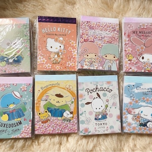 Notatnik Tokio Japonia, przykładowy notatnik Sanrio Sakura, notatnik Sanrio, Melody, Cinnamonroll, Keroppi, LTS, Pochacco, Purin, Tuxedo Sam