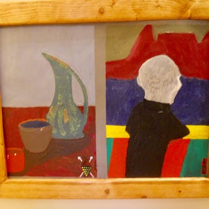 May include: An original oil painting in a wooden frame. The artwork is divided into two sections. One side features a blue pitcher and a brown cup. The other side depicts a person in a black shirt looking at a red mountain range.