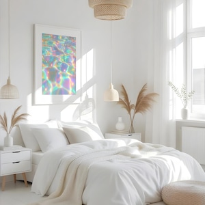 May include: A bright, airy bedroom with white bedding, a framed art print, and woven pendant lights. The art print features a colorful, iridescent water reflection. The room includes a white rug, nightstands, and a neutral-toned ottoman, creating a serene atmosphere.