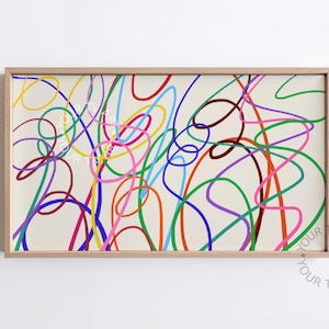 May include: Abstract art print featuring a cream background with colorful, looping lines in red, blue, green, yellow, and purple. The artwork is framed in a light wood frame, with the text "YOUR TV ART" in the bottom right corner.