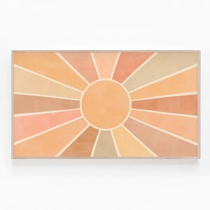 以下が含まれることがあります： オレンジ、ピーチ、ベージュの色合いで幾何学模様が施された、スタイリッシュな太陽のデジタルアートプリント。太陽はフレームで囲まれています。
