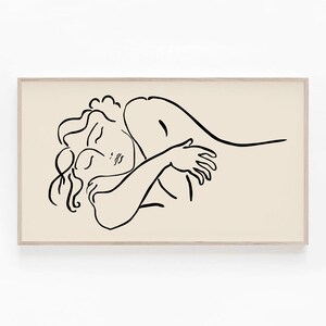 May include: A black and white line drawing of two figures embracing. The figures are drawn in a simple, minimalist style, with the woman's head resting on the man's shoulder. The drawing is set against a light beige background.