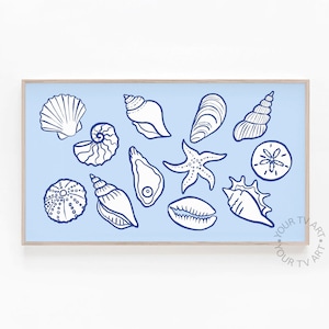 May include: A blue and white illustration of various seashells, a starfish, and a sand dollar on a light blue background. The illustration is framed in a light wood frame.