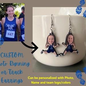 May include: Custom photo running or track earrings with a blue and white running uniform and the number 447. The earrings are personalized with a photo, name, and team logo/colors.