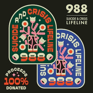 May include: Two green and blue stickers with a stylized floral design and a phone with the number 988. The text on the stickers reads "Suicide and Crisis Lifeline" and "Proceeds 100% Donated".