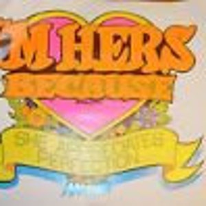 May include: A vintage sticker with a heart-shaped design. The heart is pink and orange with the word "EMHERS" in orange letters. The heart is surrounded by a yellow banner with the text "SHELTERED PERFECTION" in black letters.