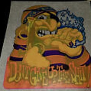 May include: A yellow and orange cartoon pirate with a purple and orange striped shirt is smoking a pipe. The pirate has a black eye patch and a bandana on his head. The text "Don't Give Up The Ship" is written in orange and yellow letters below the pirate.