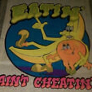 May include: A vintage, colorful, psychedelic sticker with a cartoon banana character riding a banana and the text "EAT IT AINT CHEATIN'" in pink letters.