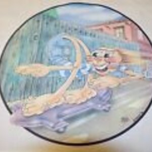 May include: A cartoon illustration of a dog skateboarding down a street. The dog is wearing a red shirt and a blue hat. The dog is smiling and has a happy expression on its face.