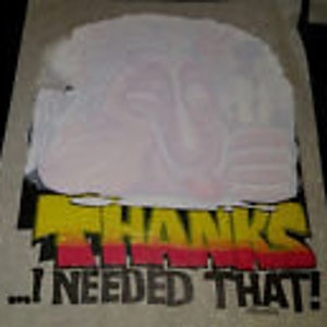 May include: White t-shirt with a yellow, orange and red graphic that says "...I NEEDED THAT!"