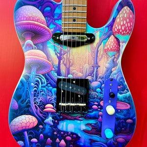May include: A blue electric guitar with a psychedelic mushroom forest design. The guitar has a light wood neck and a black pickguard.