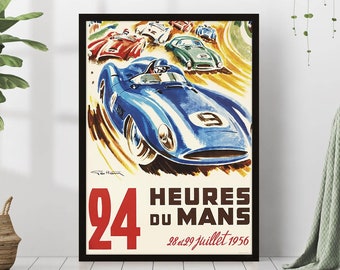 May include: Vintage poster for the 24 Hours of Le Mans race, featuring a blue race car speeding around a track with other cars in the background. The poster is framed in black and has the text "24 Heures du Mans 28 & 29 Juillet 1956".