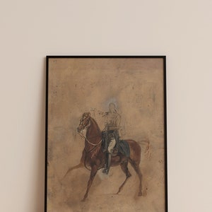 May include: A framed black and white drawing of a person on horseback. The drawing is on a brown paper background.