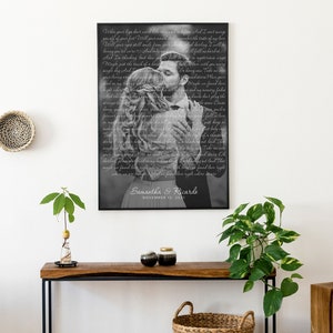 May include: Black and white photo of a couple kissing, with the lyrics of a song printed over the image. The photo is framed in a black frame and the couple's names and wedding date are printed below the image. "Samantha & Ricardo, November 12, 2021"