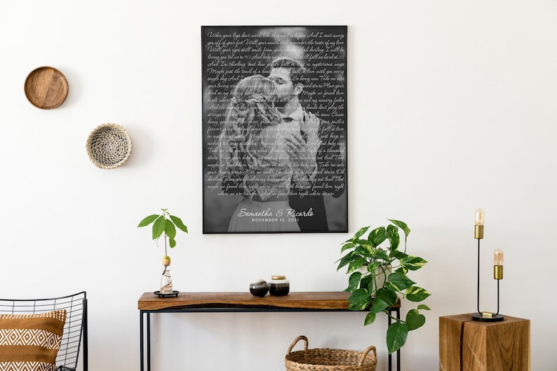 May include: Black and white photo of a couple kissing, with the lyrics of a song printed over the image. The photo is framed in a black frame and the couple's names and wedding date are printed below the image. "Samantha & Ricardo, November 12, 2021"