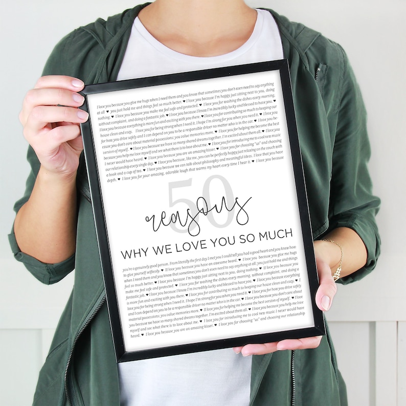May include: A framed black and white printable with the text "50 reasons why we love you so much" and a list of reasons in a gray font. The text is in a modern, handwritten font.