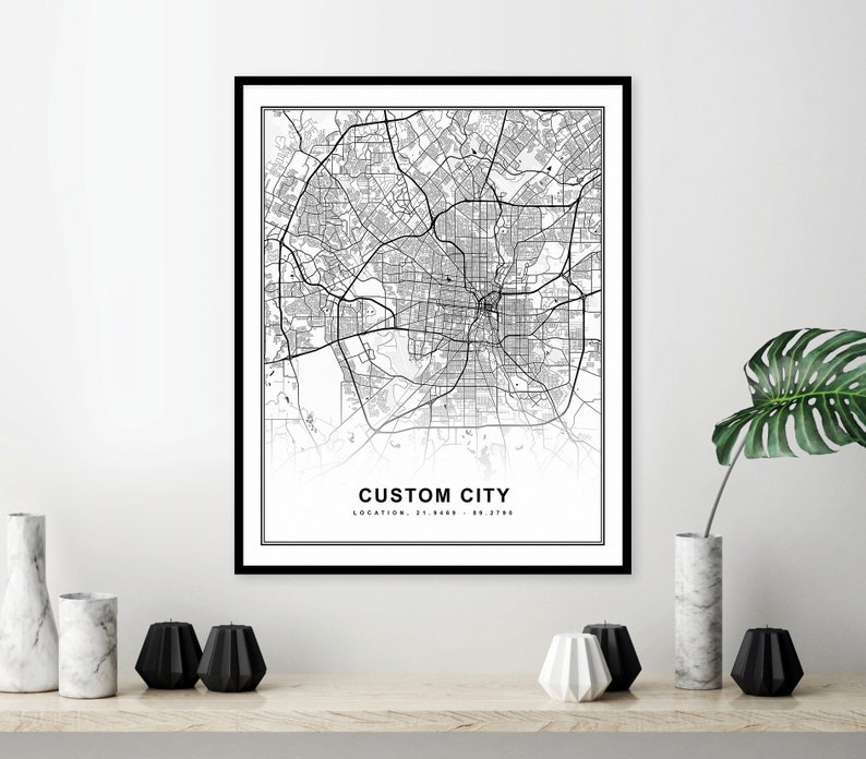 May include: Black and white city map print with the text "CUSTOM CITY" and "LOCATION: 31.9488 - 95.1778" in a black frame.