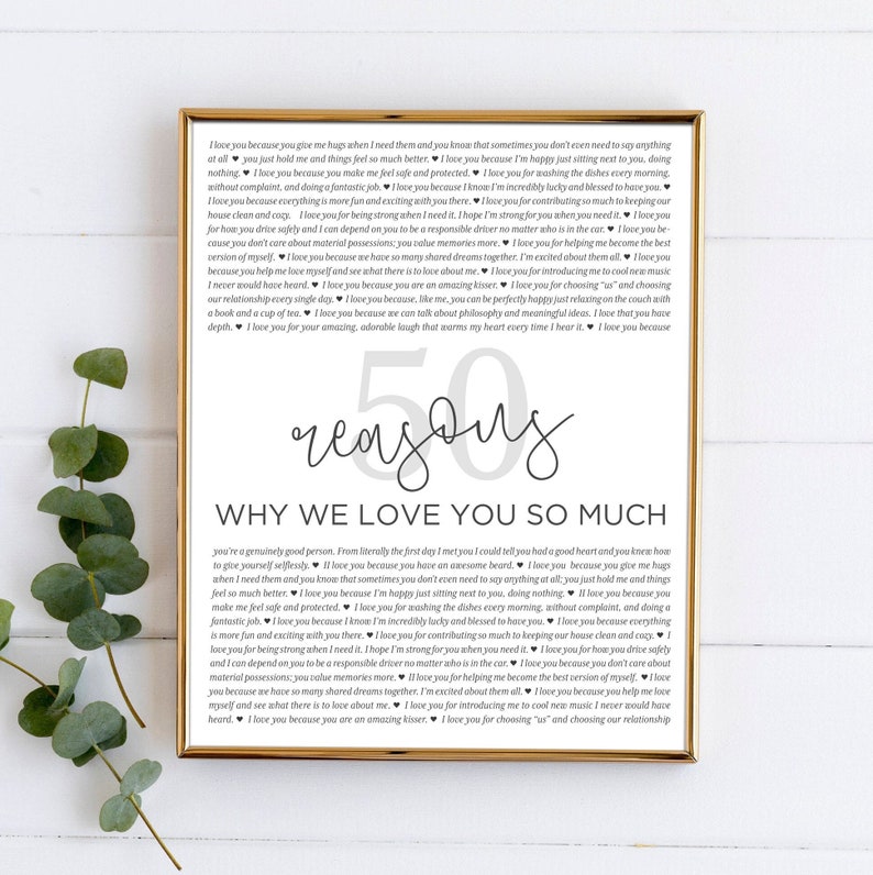May include: A printable poster with a black and white design. The poster features the text "50 reasons why we love you so much" and a list of reasons why someone is loved. The poster is framed in a gold frame.