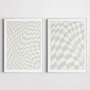 以下が含まれることがあります： 薄い緑と白のチェック柄の額装されたプリントが2枚。パターンが歪んで波打つような効果を生み出しています。