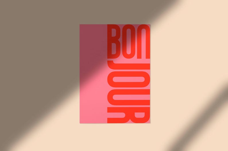 Pode incluir: Um cart&atilde;o rosa com a palavra "BONJOUR" em letras vermelhas.
