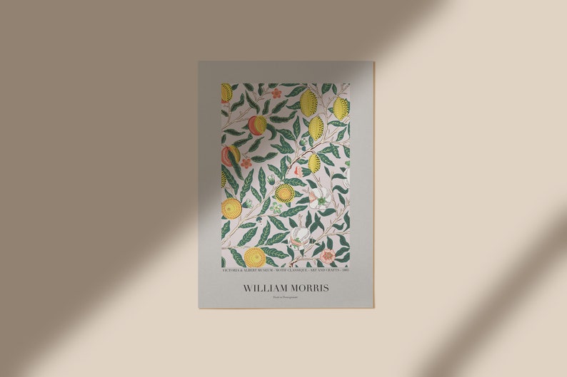 May include: A poster featuring a floral pattern with green leaves, yellow lemons, and pink flowers. The text "VICTORIA & ALBERT MUSEUM, SOUTH KENSINGTON, ART AND EXHIBITIONS, 1881" and "WILLIAM MORRIS" is printed at the bottom of the poster.