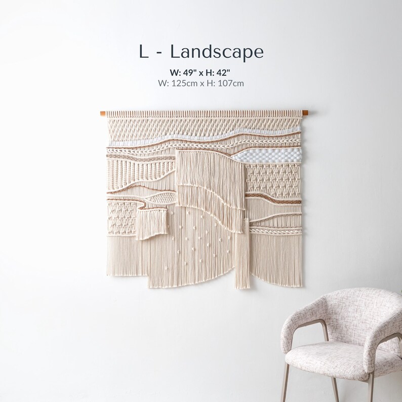 Large landscape-oriented boho macrame wall art measuring 49 by 42 inches. The handmade fiber art features dynamic, asymmetrical waves of textured knots and thick, flowing fringe.