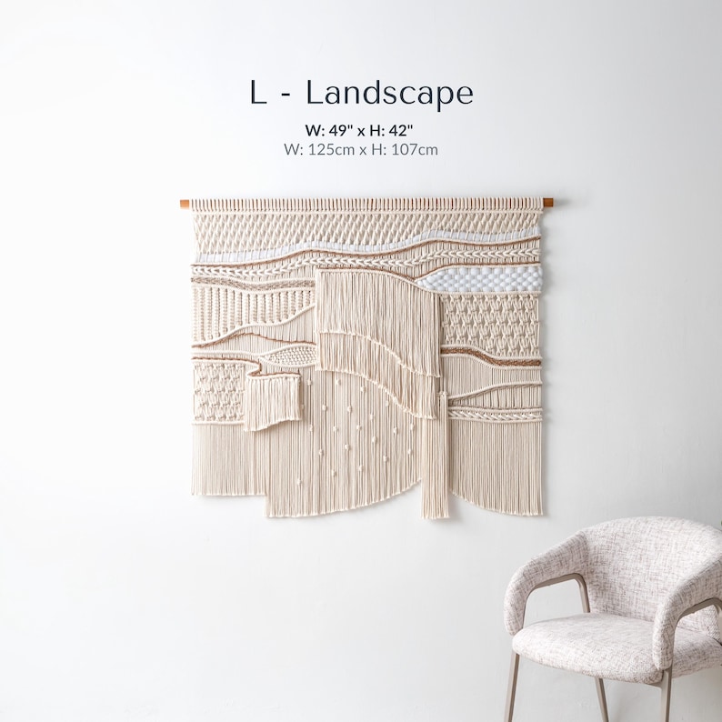 Large landscape-oriented boho macrame wall art measuring 49 by 42 inches. The handmade fiber art features dynamic, asymmetrical waves of textured knots and thick, flowing fringe.