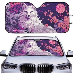 May include: A car sunshade with a white fox and pink cherry blossoms on a purple background. The sunshade is designed to fit a car windshield.