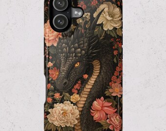 May include: Black phone case featuring a dragon design amidst a floral pattern. The dragon has a detailed, textured appearance with yellow eyes. The flowers are in shades of pink, peach, and cream, set against a dark background.