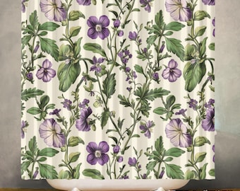 May include: A floral shower curtain featuring a botanical design with purple and white flowers, green leaves, and stems against a cream-colored background. The curtain is hanging in front of a white bathtub.