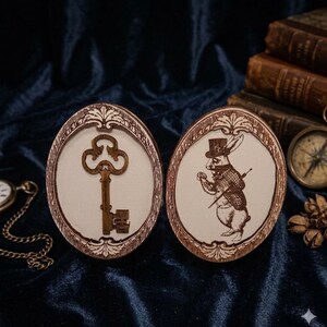 May include: Two oval wooden plaques with a vintage key and a rabbit in a top hat illustration. The key is a dark brown color, and the rabbit is wearing a suit and holding a cane. The plaques have a decorative border.