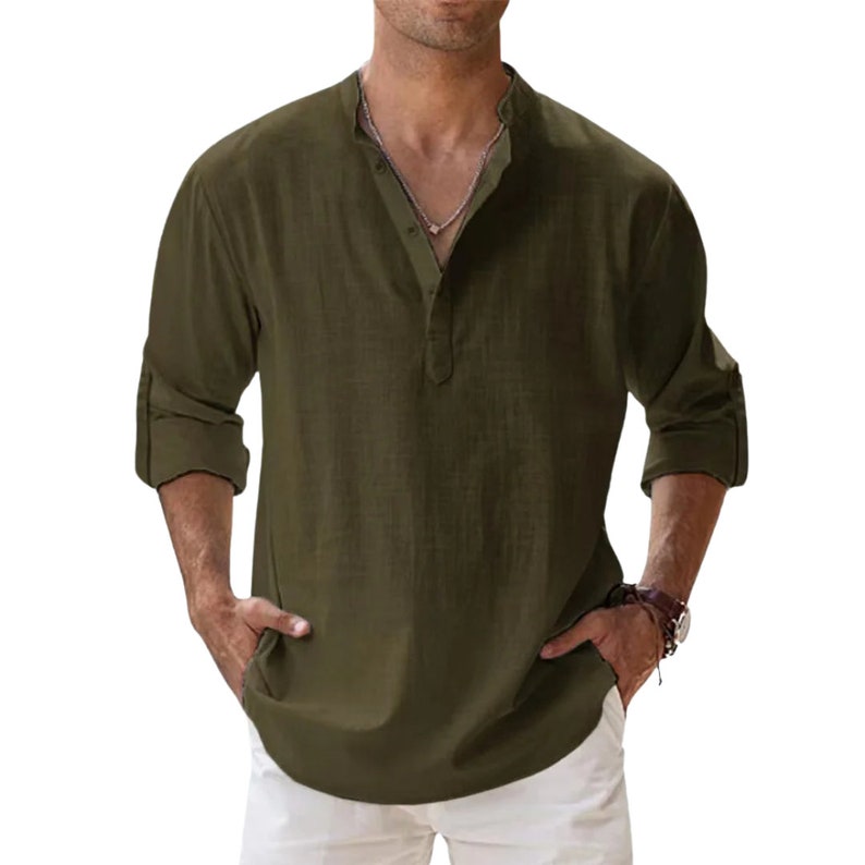 a man wearing a green shirt and white shorts