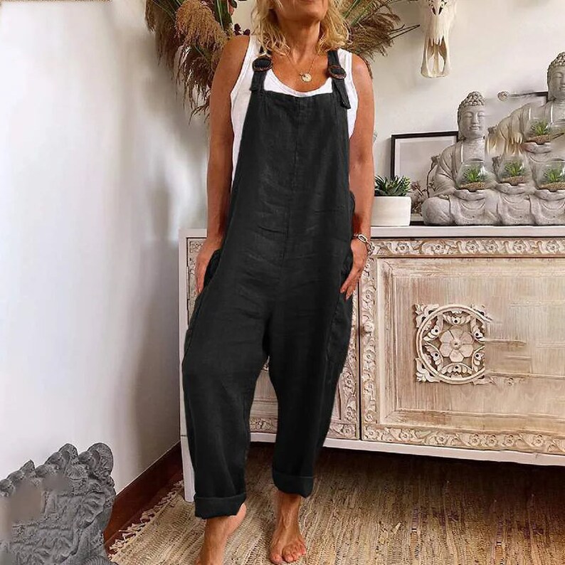 a woman standing in front of a dresser