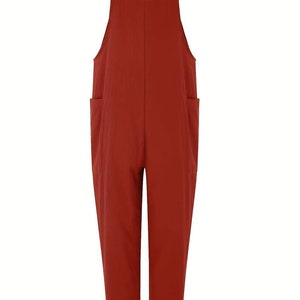 a woman wearing a red jumpsuit with pockets