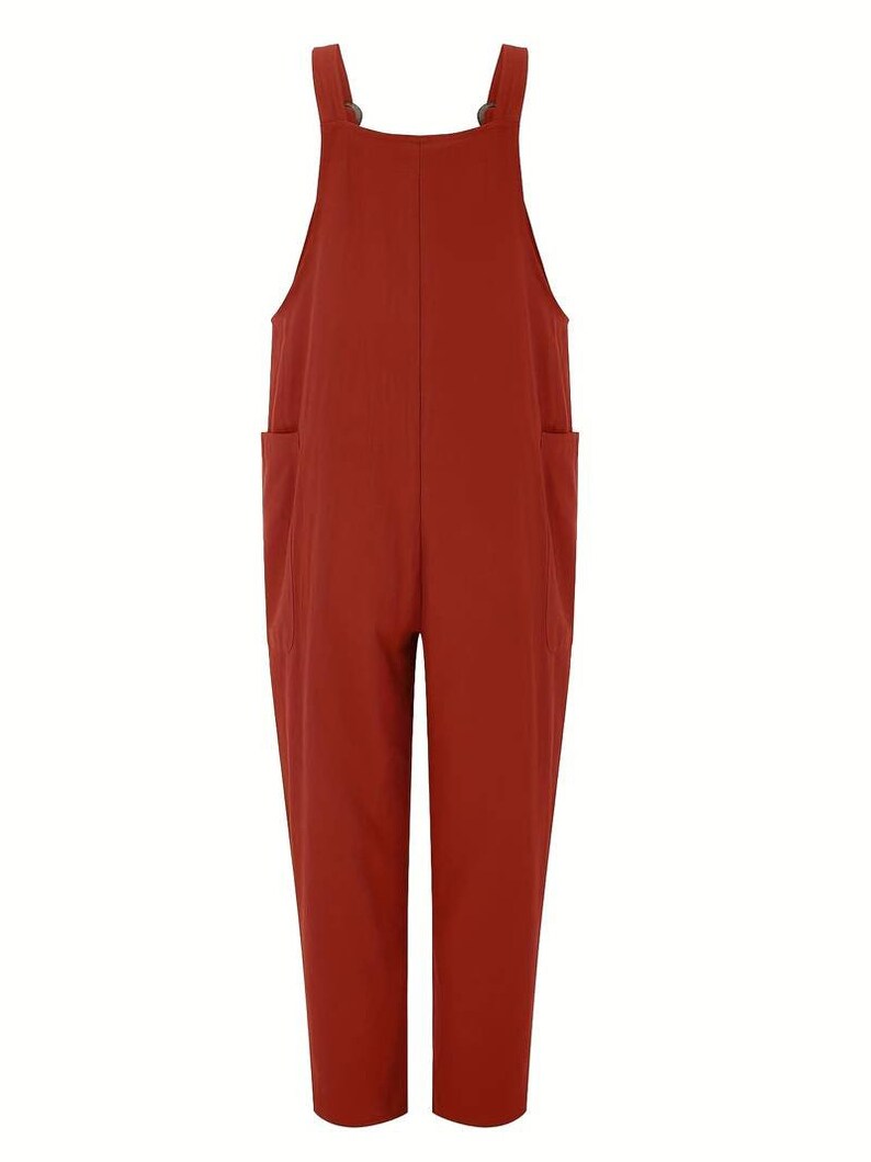 a woman wearing a red jumpsuit with pockets