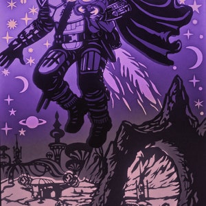 May include: A layered paper art piece featuring a character in armor holding a small creature, set against a purple space scene with stars, planets, and a moon. The artwork has a cut-paper style with black and white details.