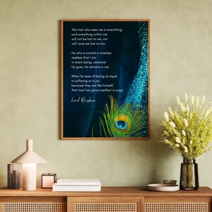 May include: A framed print with a blue and green peacock feather design. The print features a quote by Lord Krishna: "The man who sees me in everything and everything within me will not be lost to me, nor will I ever be lost to him."