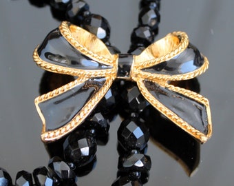 Vintage Kenneth Jay Lane KJL jewelry for Avon Black enamel gold bow bolo lariat clip Mid century costume jewelry