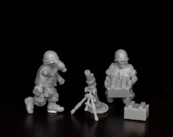May include: Miniature gray plastic military figures, including two soldiers, a mortar, and ammunition crates. One soldier is running, while the other is carrying supplies. The mortar is on a tripod.