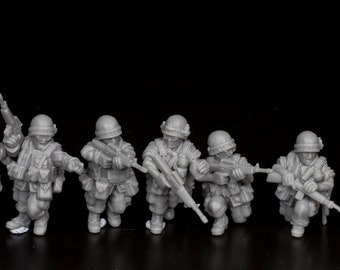 May include: A set of eight gray plastic toy soldiers, each holding a rifle, standing in a line on a black surface.