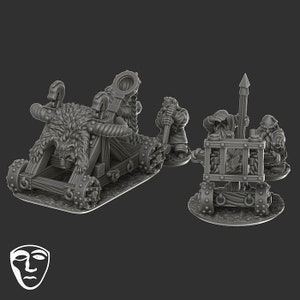 May include: A miniature model of a siege weapon, a catapult, with a furry ram, and four dwarves operating it. The catapult is made of wood and has a rope and a metal hook. The dwarves are wearing helmets and armour. The catapult is on a base with a textured surface.