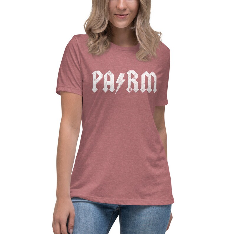 May include: A heather red t-shirt with a white graphic that says "PA/RM" in a rock and roll font with a lightning bolt between the letters.