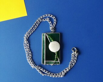 Rectangular pendant made of stained glass and glass beads. A necklace with an interesting artistic pendant. Green designed pendant