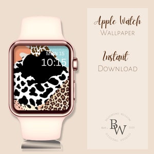 May include: A pink Apple Watch with a white band and a digital clock face displaying "MON 15 10:15". The watch face has a colorful abstract design with animal print patterns.